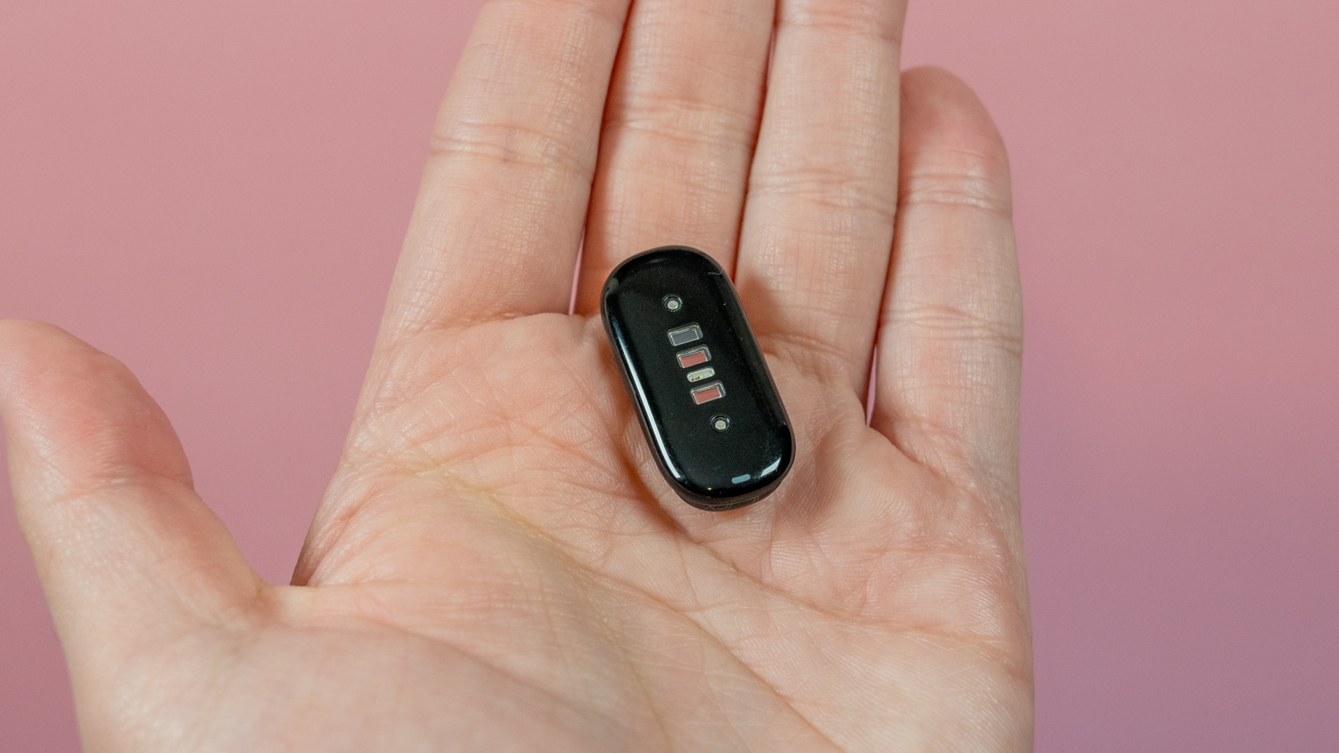 Fitbit Air puck in hand