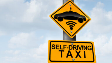 Self Driving robot Taxi AI Artificial Intelligence or robotaxi with a driverless cars as a robo-taxi robotic wireless technology concept as a traffic sign with a self-driving vehicle as a symbol.