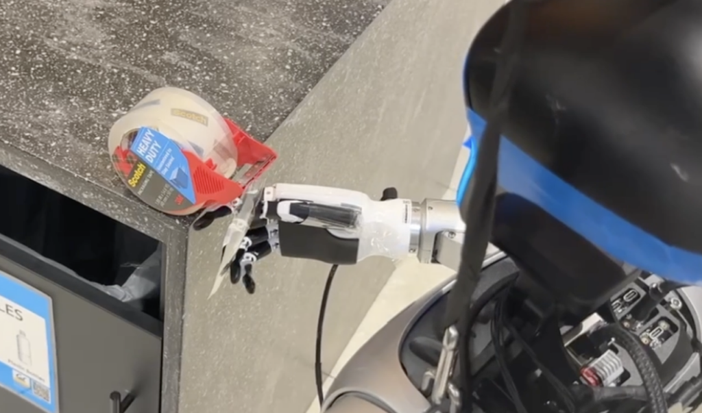 A robot peels off a piece of tape