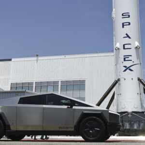 SpaceX signage outside the Space Exploration Technologies Corp. facility in Hawthorne, California, on June 3, 2026. A Tesla Cybertruck sits in the foreground.