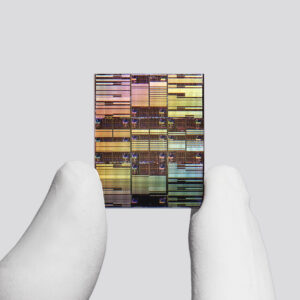 Researcher holding IBM’s sub-1nm node chip.