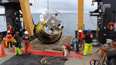 NOAA crew retrieving buoy