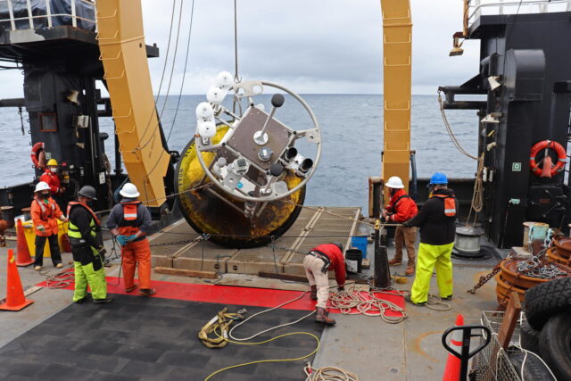 NOAA crew retrieving buoy