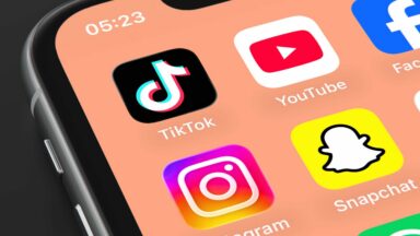 A phone screen displays app icons for TikTok, YouTube, Facebook, Instagram, and Snapchat.