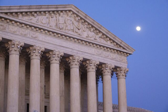 Exterior view of Supreme Court building and its marble columns.