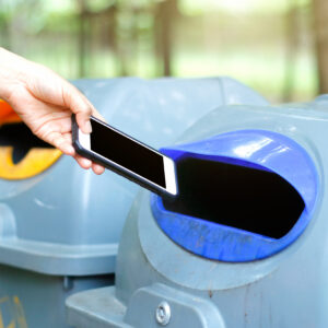 Woman throwing a phone into the trash