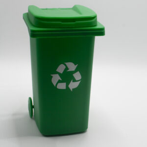 Green recycling bin with the recycling symbol on a white background.