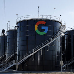 An exterior view of the Google data center in Midlothian, Texas. The Google symbol is visible alongside the American flag and Texas state flag.