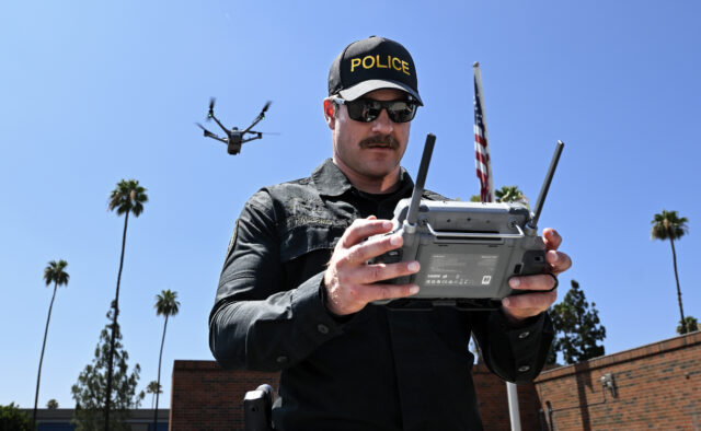 Officer Taylor Palmero practices agility drills while flying an unmanned aerial vehicle at the Riverside Police Department