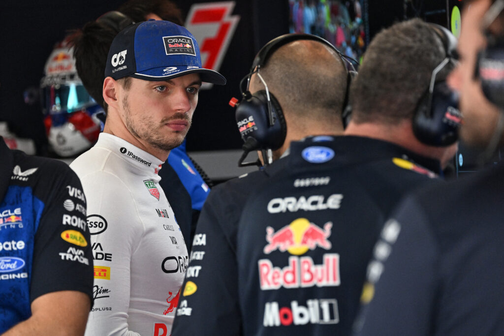 Red Bull Racing's Dutch driver Max Verstappen (L) is pictured in the garage before the qualifying session ahead of the Formula One British Grand Prix at the Silverstone motor racing circuit in Silverstone, central England, on July 4, 2026. (Photo by PETER POWELL / POOL / AFP via Getty Images)