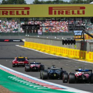 The group follows the safety car during the Formula 1 Pirelli British Grand Prix 2026 at the Circuit of Silverstone in Silverstone, United Kingdom, on July 5, 2026. (Photo by Paul Foster/Alessio Morgese/NurPhoto via Getty Images)