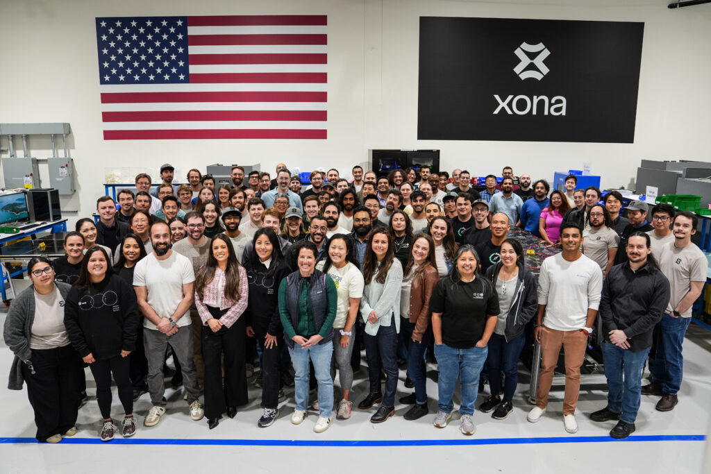 A group photo of the Xona Space Systems team inside the company's factory in Burlingame, California.