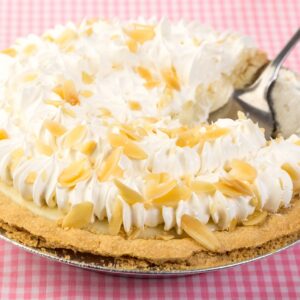 A banana cream pie with a fork sticking out of it