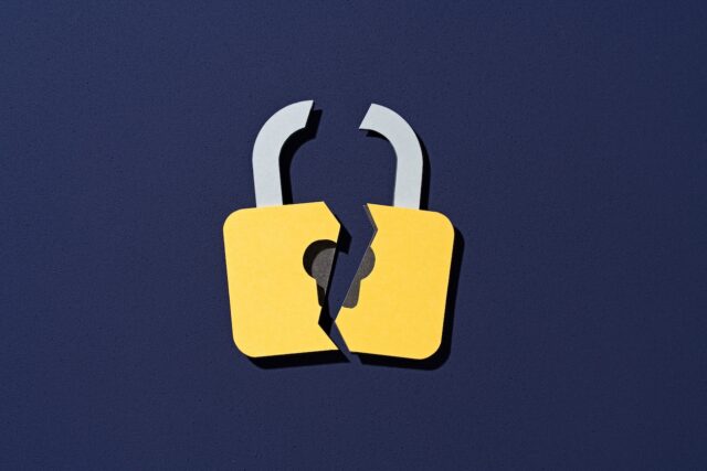 Paper Craft of Cracked Yellow Lock on Purple Background Front View, Data Security Concept.