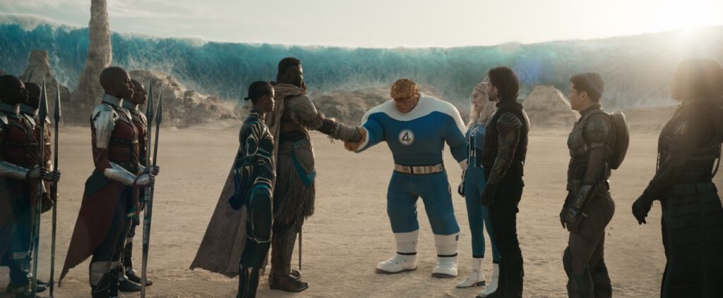 Thing shakes hands with a Wakandan as others look on