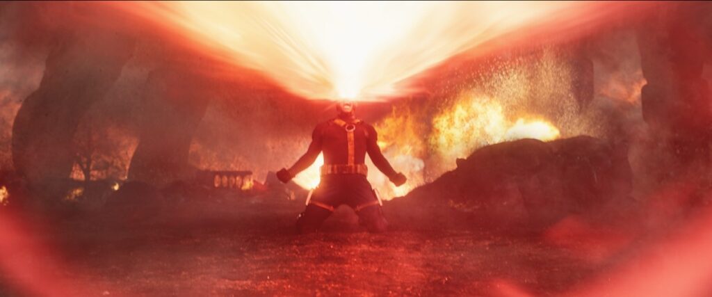 Cyclops in X-Men costume, beams pouring out of his eyes and causing a lot of destruction