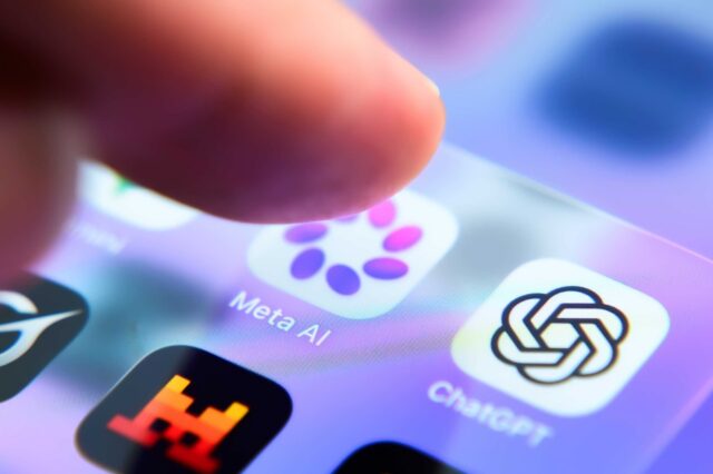A person's finger hovers over a smartphone app icon for the Meta AI app