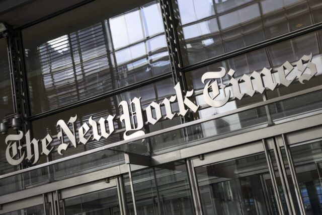 The New York Times logo above the doors of the news organization's building in New York City.