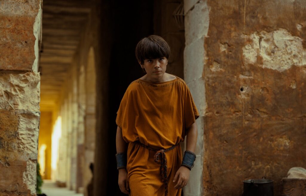 Avianius, played by Frankie Treadaway, strides home through Pompeii after his argument with Marcus Masurius.