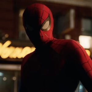 closeup of spiderman on a city street at night