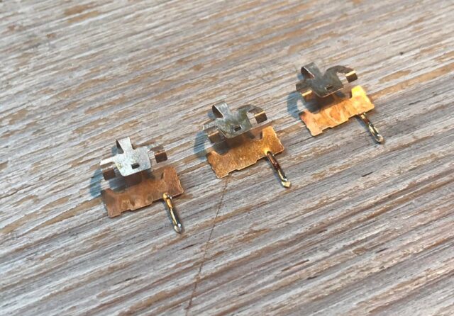 Three mechanical switch leaves showing oxidation
