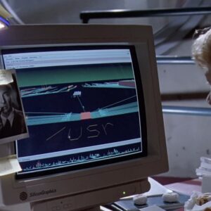 A still from Jurassic Park, showing a young woman sitting at an SGI workstation
