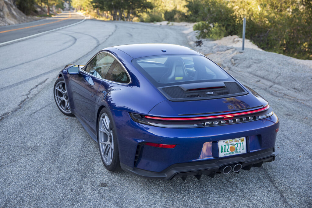 A blue Porsche 911 GT3 facing away from the camera