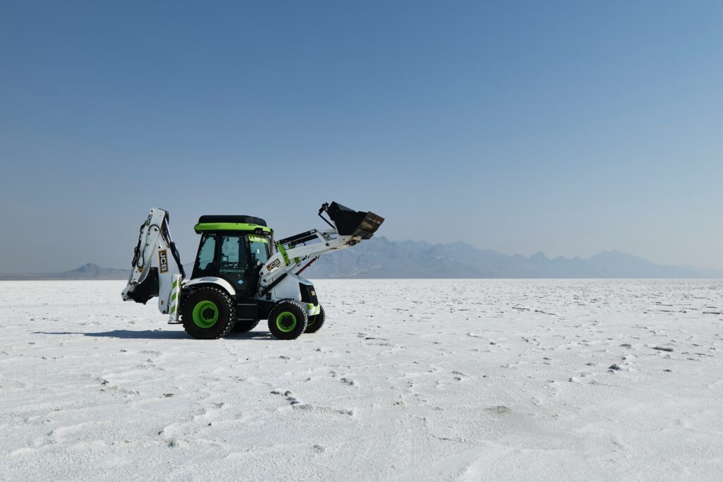 A white and green digger