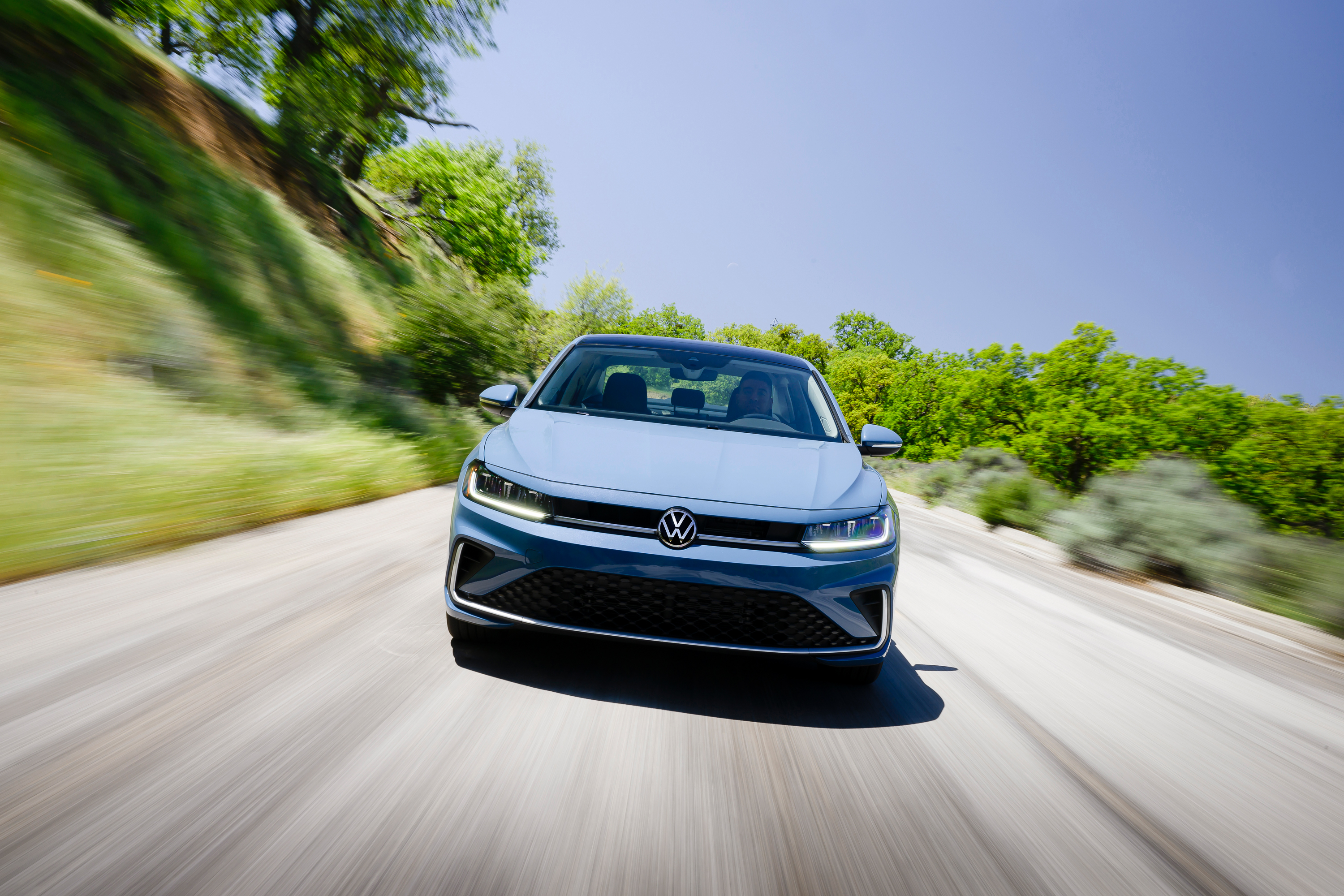 A VW Jetta drives towards the camera