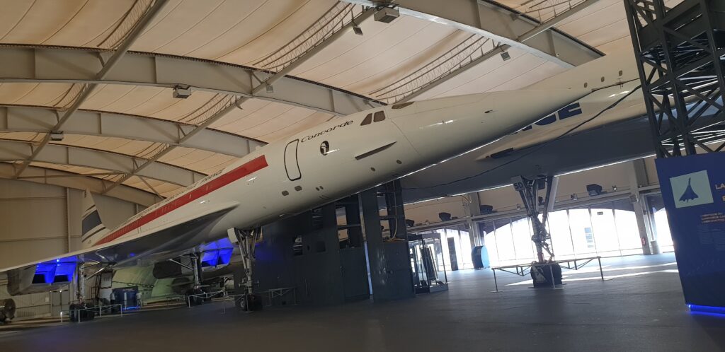 Image of two aircraft, similar in design, but with one substantially larger than the other.