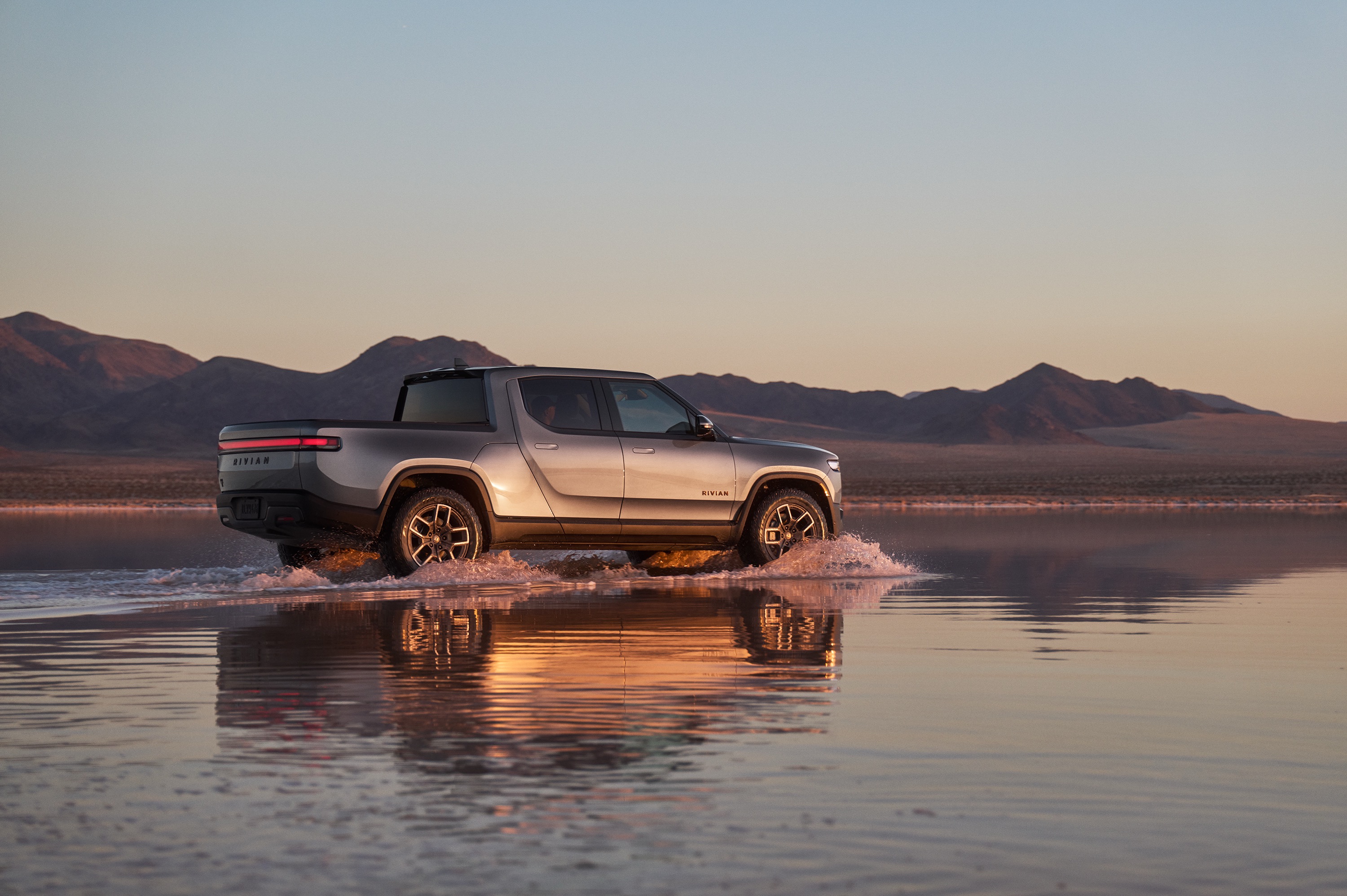 A silver Rivian truck