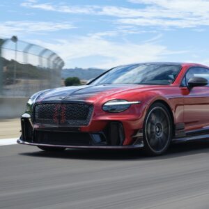 A red and black Bentley on track at Laguna Seca