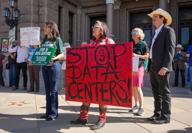 People hold signs opposing data centers during ap protest at the Capitol in Austin on July 27, 2026.