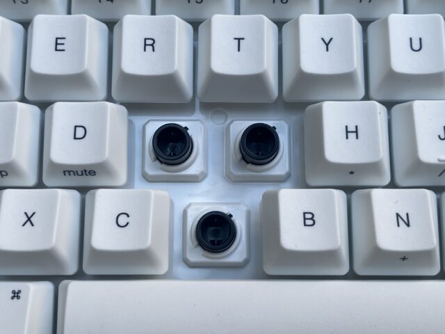 A birdseye view of the HHKB’s Professional Classic Type-S keyboard with the F, G, and V, keycaps removed, exposing the EC switches beneath.
