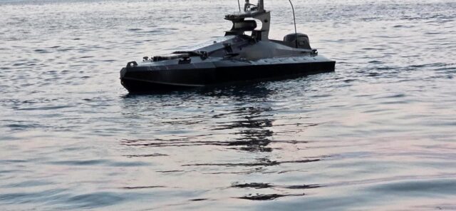 A drone boat loaded with explosives found near Romania's Neptun Deep gas project in the Black Sea. The uncrewed surface vessel is painted black.