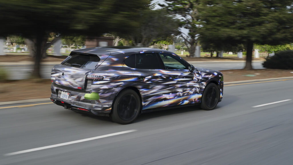 A camouflaged preproduction Bentley Torcal drives away from the camera