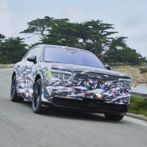 A camouflaged preproduction Bentley Torcal drives towards the camera