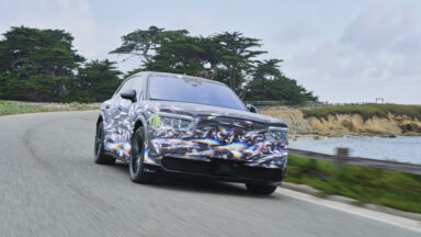 A camouflaged preproduction Bentley Torcal drives towards the camera