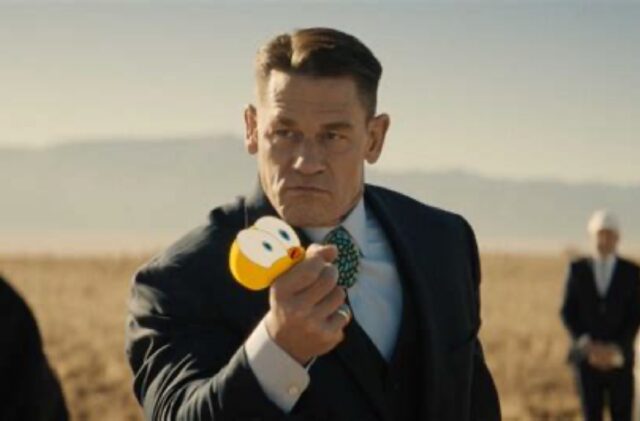 large muscular lawyer squeezing little yellow cartoon bird in his fist