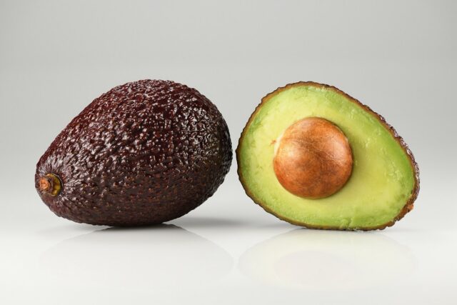The Hass avocado – single and halved. Grown in Colombia