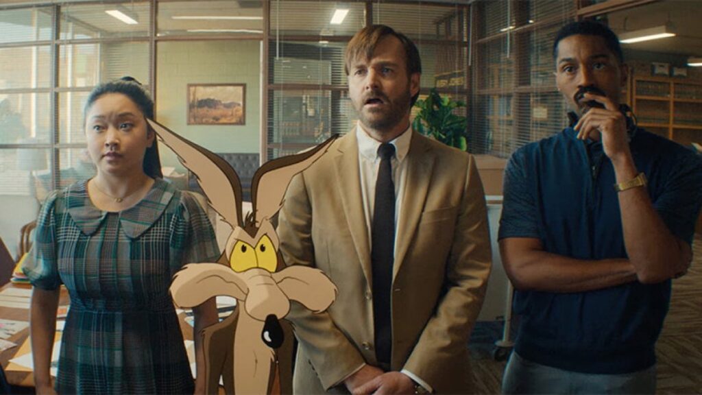 cartoon coyote standing with three humans in shabby suits/outfits