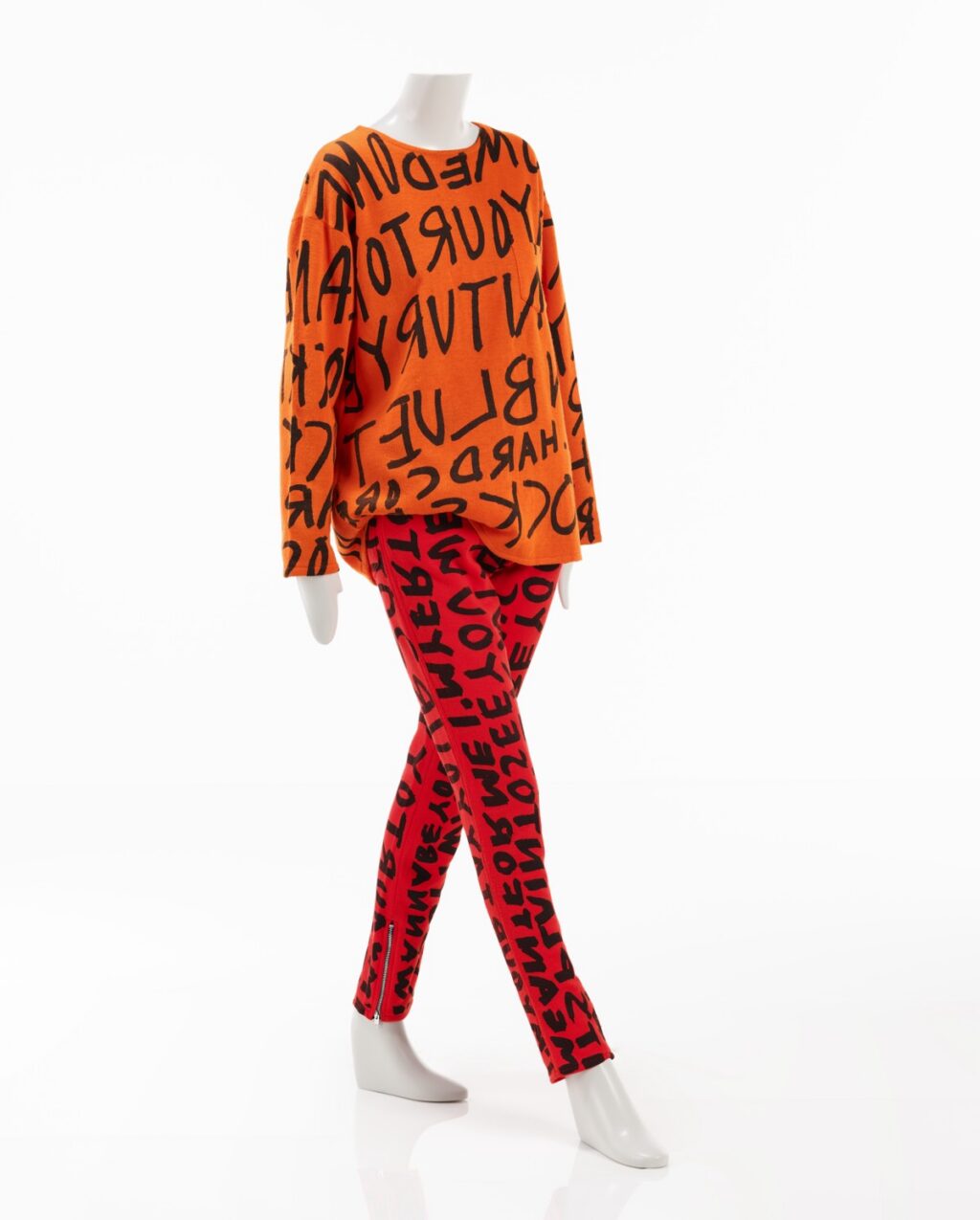 Attention-grabbing DayGlo orange shirt and pants with Stephen Sprouse’s trademark graffiti pattern