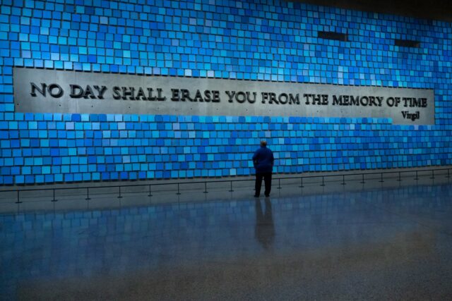 Bill Spade stands in front of the memorial wall at the 9/11 Memorial & Museum