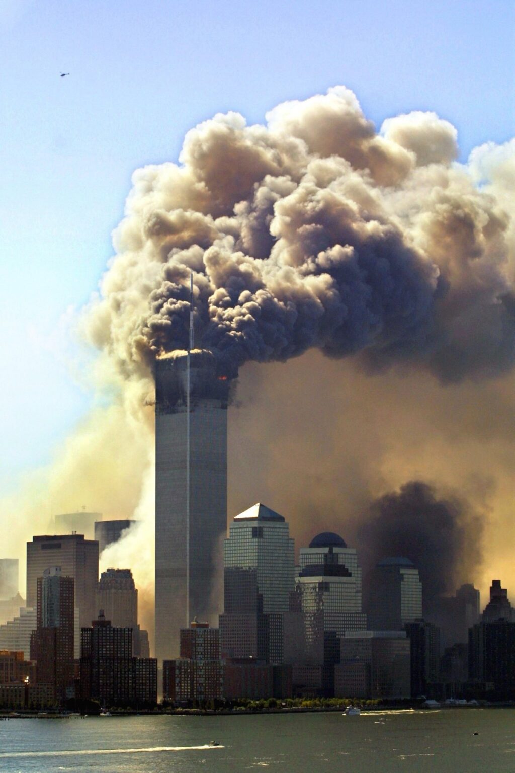 Clouds of smoke rise from the burning upper floors just before the second of the twin towers of the World Trade Center in New York collapsed