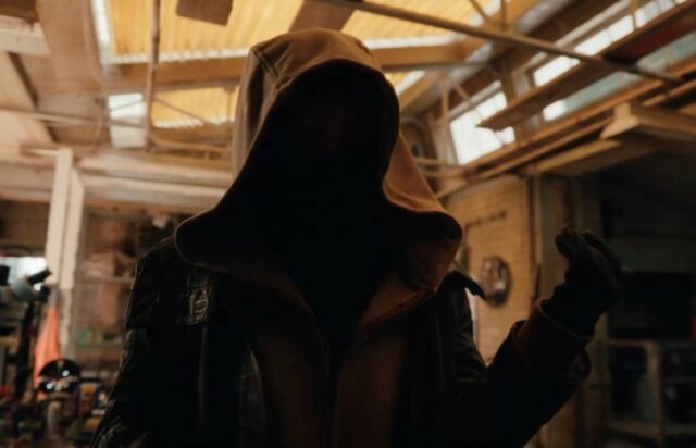 a mysterious cloaked figure