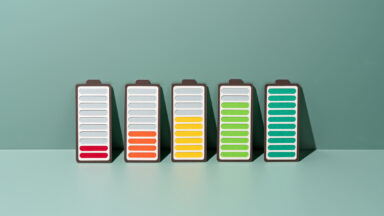 Paper Craft of a row of Rechargeable Batteries Gradually Charging to Full on a Green Background .