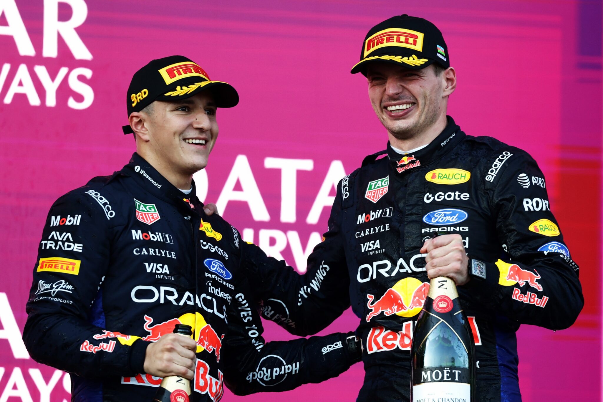 BAKU, AZERBAIJAN - SEPTEMBER 26: Second placed Max Verstappen of the Netherlands and Oracle Red Bull Racing and Third placed Isack Hadjar of France and Oracle R