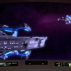 Two images of an identical starship against a black background.