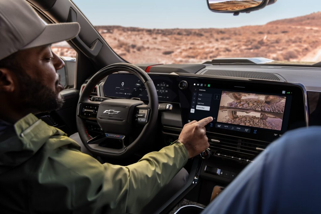A man uses the infotainment in a truck
