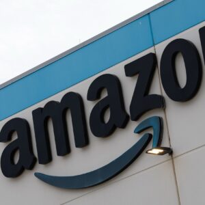 An Amazon company logo affixed to the exterior of a building.